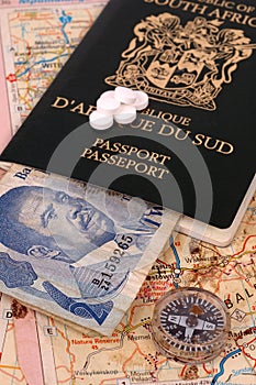 Map, compass, African money, passport and Tablets