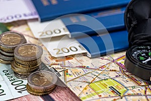 Map compass passport and euro money.