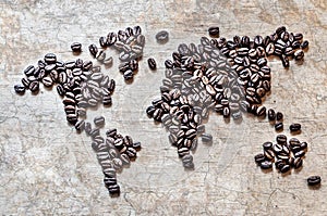 Map of continents from coffee beans on a wooden background