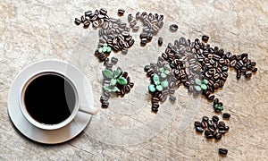 Map of continents from coffee beans on a wooden background