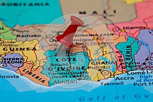 Map of Cote D`ivoire with a red pushpin stuck