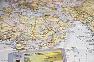 Map with East Africa Tourist Visa in passport