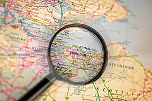 Map of Edinburgh through magnifying glass, UK city