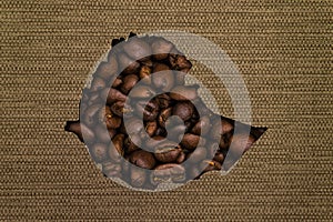 Map of Ethiopia made up of coffee beans on a background of canvas fabric