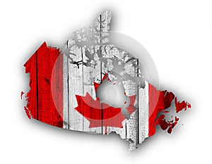 Map and flag of Canada on weathered wood