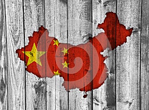 Map and flag of China on weathered wood