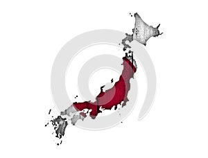 Map and flag of Japan on weathered wood