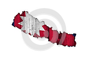 Map and flag of Nepal on weathered wood