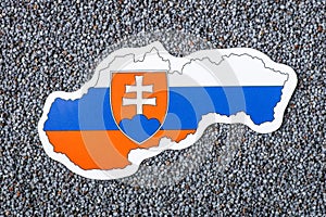 Map and flag of Slovakia on harvested poppy seed