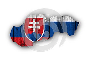 Map and flag of Slovakia on weathered wood