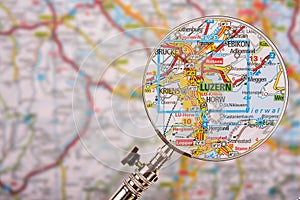 Map of Luzern Lucerne with magnifying glass on table