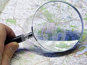 Map and magnifying glas