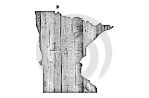 Map of Minnesota on weathered wood