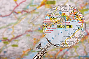 Map of Neuchatel with magnifying glass on table