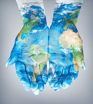 Map painted on hands.Concept of having the world in our hands