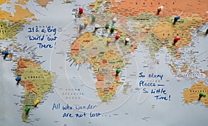 Map with Push Pins and Travel Quotes