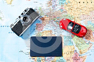 Map of roads with a vintage camera, passport. The concept of travel