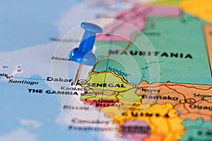 Map of Senegal with a blue pushpin stuck photo