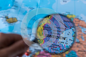 Map of Sweden through magnifying glass.