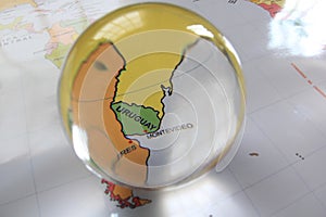 Map view with crystal ball pointing Uruguay