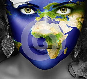 Map of the world on face of girl