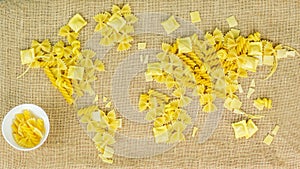 Map of the world made of raw pasta on fabric background