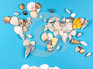 Map of the world made of shells on blue background