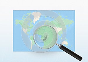 Map of the World with a magnifying glass aimed at Congo, searching Congo with loupe
