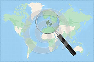 Map of the world with a magnifying glass on a map of Denmark