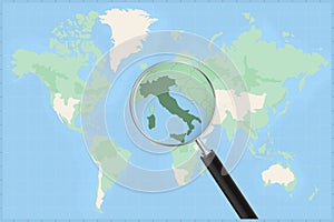 Map of the world with a magnifying glass on a map of Italy