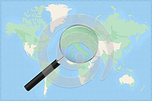 Map of the world with a magnifying glass on a map of San Marino