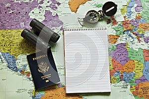 Map of the world with notepad, passport,compass an
