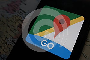 Maps and iphone 11 pro with the Google Maps logo