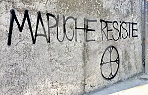Mapuche Resiste words on a builiding photo