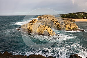 The rocks at Mar Chiquita Beach near San Juan, Puerto Rico photo
