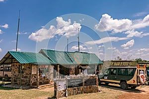 Mara Triangle Gate Landcruiser tourist vehicle van parked at the Maasai Mara River National Game Reserve Park And Conservation Are