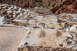 Maras salt mines peruvian Andes Cuzco Peru photo