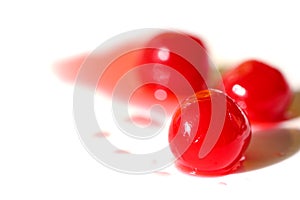 Maraschino cherry on white background