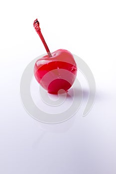 Maraschino cherry on white background