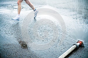 Marathon runner on wet city street photo