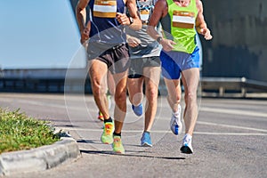 Marathon runners on city road