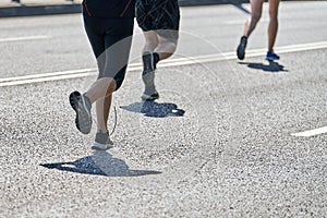 Marathon runners on city road