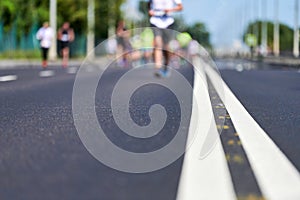 Marathon runners on city road