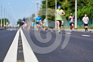 Marathon runners on city road