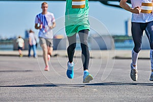 Marathon runners on city road