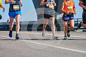 Marathon runners on city road