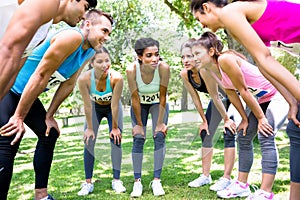 Marathon runners discussing in park