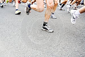 Marathon runners, motion blur on running shoes