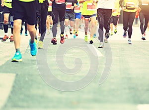 Marathon runners running on city road