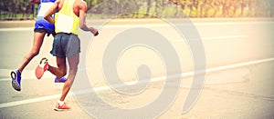 Marathon runners running on city road